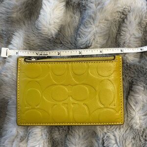 Coach Embossed zip card case
